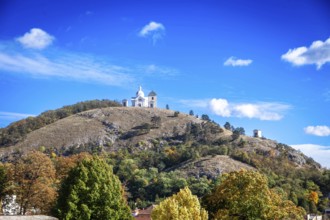 A chapel on a hill with soft autumn colours under a clear blue sky, Mikulov Nikolsburg Czech