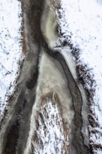A frozen stream with snow cover in abstract form, Kamptal Waldviertel Austria