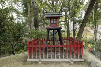 Inari-jinja Shrine on Mount Kifuku in Shukkei-en with blossoming cherry trees, sakura, and