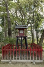 Inari-jinja Shrine on Mount Kifuku in Shukkei-en with blossoming cherry trees, sakura, and
