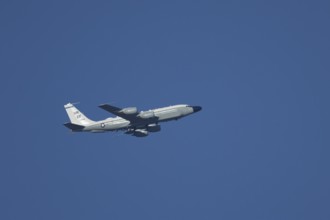 RC-135W Rivet Joint military jet aircraft of the United States Air Force USAF flying, England,