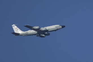 RC-135W Rivet Joint military jet aircraft of the United States Air Force USAF flying, England,