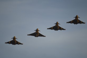 Eurofighter Typhoon four military fighter jet aircraft of the Royal air force RAF flying in