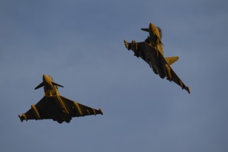 Eurofighter Typhoon two military fighter jet aircraft of the Royal air force RAF flying in