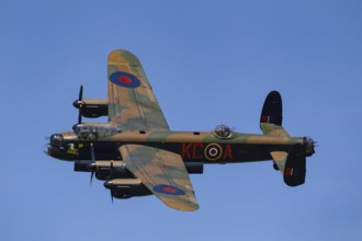 Avro Lancaster warbird military aircraft in Royal air force RAF colours flying, England, United