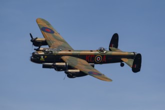 Avro Lancaster warbird military aircraft in Royal air force RAF colours flying, England, United
