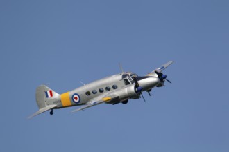 Avro Anson warbird military aircraft in Royal air force RAF colours flying, England, United Kingdom
