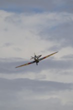 Hawker Hurricane warbird military aircraft in Royal air force RAF colours flying, England, United