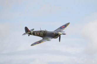 Supermarine Spitfire warbird military aircraft in Royal air force RAF colours flying, England,