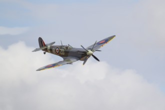 Supermarine Spitfire warbird military aircraft in Royal air force RAF colours flying, England,