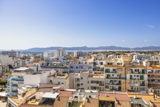 Skyline view over a residential area with apartment houses and the mountains and the Mediterranean