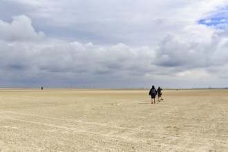 Wide sandy beach, walkers on the horizon, Sankt Peter-Ording, Eiderstedt peninsula, Wadden Sea