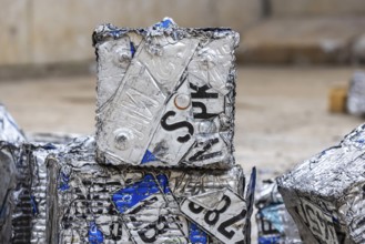Cubes made from scrap metal, disused car licence plates. Symbolic photo. Stuttgart,