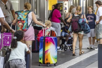 Stuttgart main station. Group of travellers on the platform with colourful suitcases. Stuttgart,