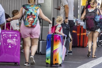 Stuttgart main station. Group of travellers on the platform with colourful suitcases. Stuttgart,