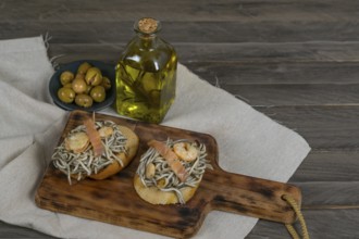 Gulas with garlic prawns in earthenware casserole dish