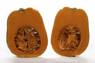 Close-up of halved pumpkin isolated on white background