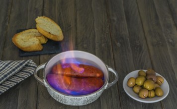 Spicy chorizo to hell cooked over a fire right on the table