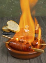 Spicy chorizo to hell cooked over a fire right on the table