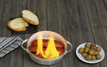 Spicy chorizo to hell cooked over a fire right on the table