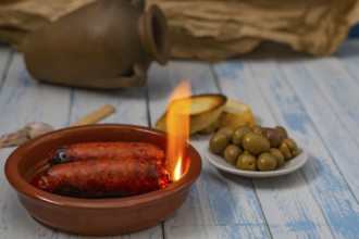 Spicy chorizo to hell cooked over a fire right on the table