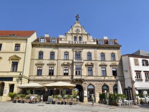 Historic building with baroque façade and decorative windows on a sunny town square Mödling Lower
