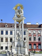 Baroque monument with ornate columns and figures on a Trinity Column Old Town Krems Wachau