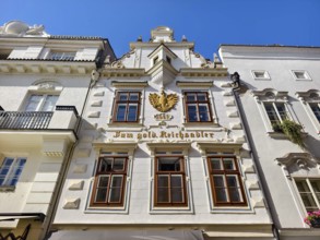 Decorative historic façade with eagle on a bright blue sky Old town Bürgerhaus Zum goldenen