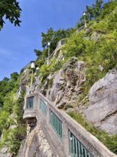 Historic staircase embedded in the rock, surrounded by greenery, urban flair Stairway to the Graz