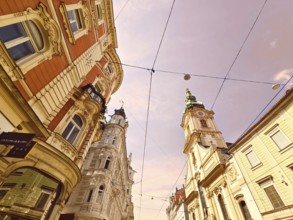 View of ornate historic buildings of a city under a sunny sky Herz Jesu Kirche Graz Styria Austria