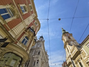 Historic buildings in an urban setting, spanned by a blue sky Herz Jesu Kirche Graz Styria Austria