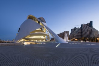 Futuristically designed building in urban surroundings with evening lighting Opera
