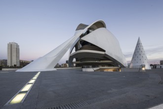 Futuristic white building with a long entrance on an empty urban space at dusk Opera