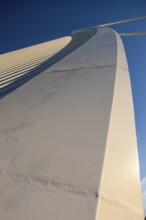 Detailed view of a structural component of a bridge under a blue sky