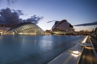 Valencia Spain Large modern building at sunset with illuminated sky and water City of Arts and