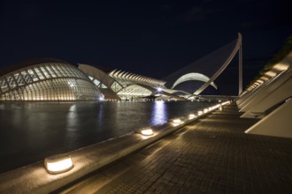 Valencia Spain Evening city view with illuminated modern bridge and buildings