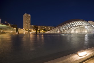 Valencia Spain Night scene with modern building and skyscraper on the calm water City of Arts and