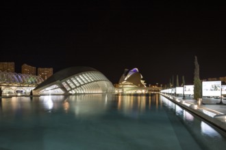 Valencia Spain Nocturnal urban scenery with illuminated modern buildings and water City of Arts and
