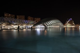 Valencia Spain Night view of the city with modern buildings and water in the foreground City of