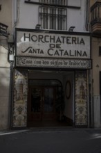 Traditional Valencian restaurant with decorative tiles and characteristic signage