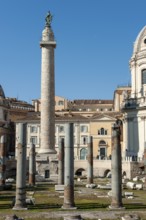 View of part of historic Trajan's Forum with ancient column fragments from Basilica Ulpia in front,