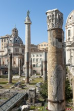 View of part of historic Trajan's Forum with ancient column fragments in front, behind it 40 metre