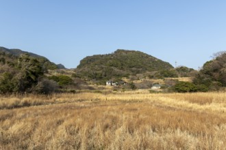Residential houses in a rural mountain landscape in the evening light, Hota, Kyonan, Chiba