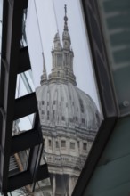 Dome of St. Pauls cathedral reflected in a building, City of London, England, United Kingdom