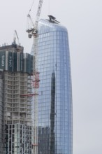 Mechanical crane on a skyscraper building, City of London, England, United Kingdom
