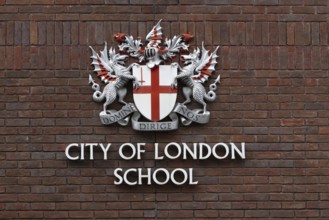 City of London school sign and coat of arms on a building, City of London, England, United Kingdom