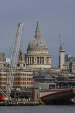 Dome of St. Pauls cathedral overlooking the river Thames, City of London, England, United Kingdom