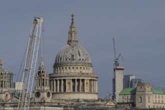 Dome of St. Pauls cathedral and mechanical cranes, City of London, England, United Kingdom