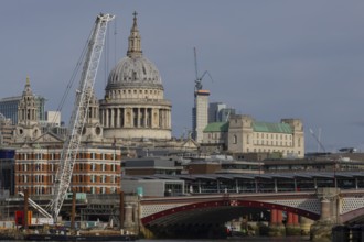 Dome of St. Pauls cathedral and mechanical cranes, City of London, England, United Kingdom