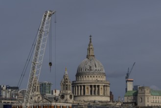 Dome of St. Pauls cathedral and mechanical cranes, City of London, England, United Kingdom